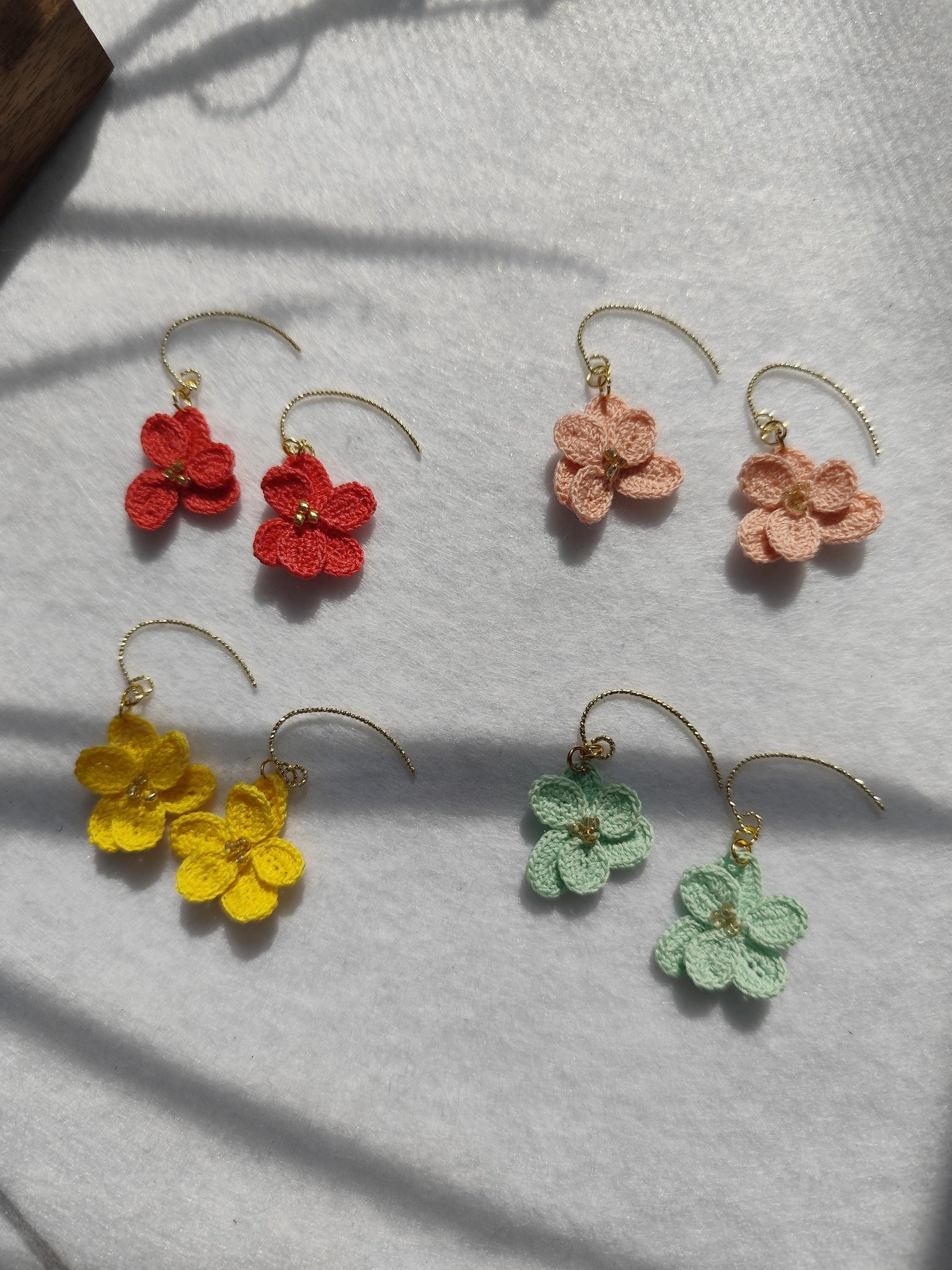 Handmade Micro Crochet Winterlinge aconite flower earrings - colorful and delicate floral design