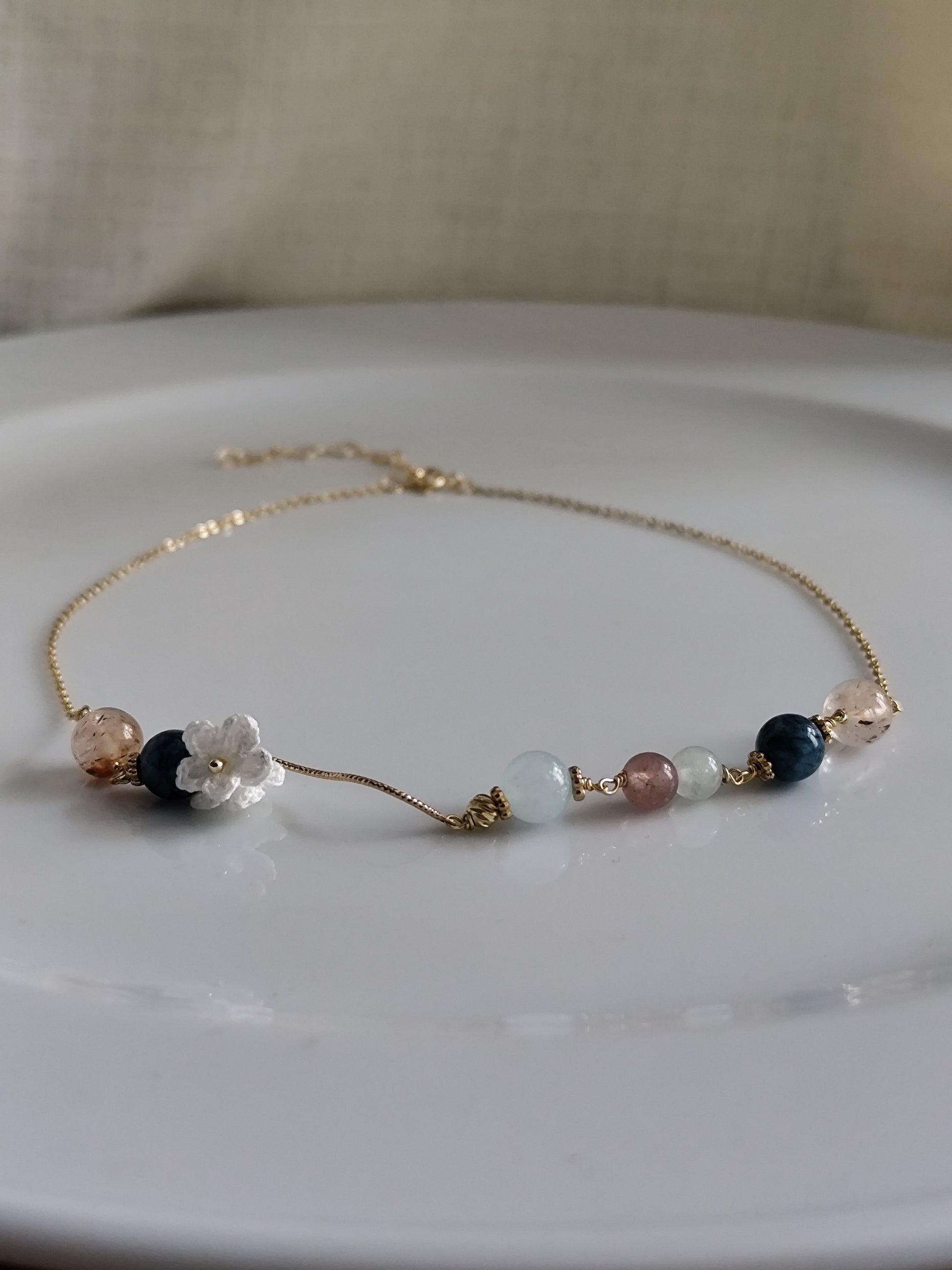 Gemstone design necklace with crocheted flowers