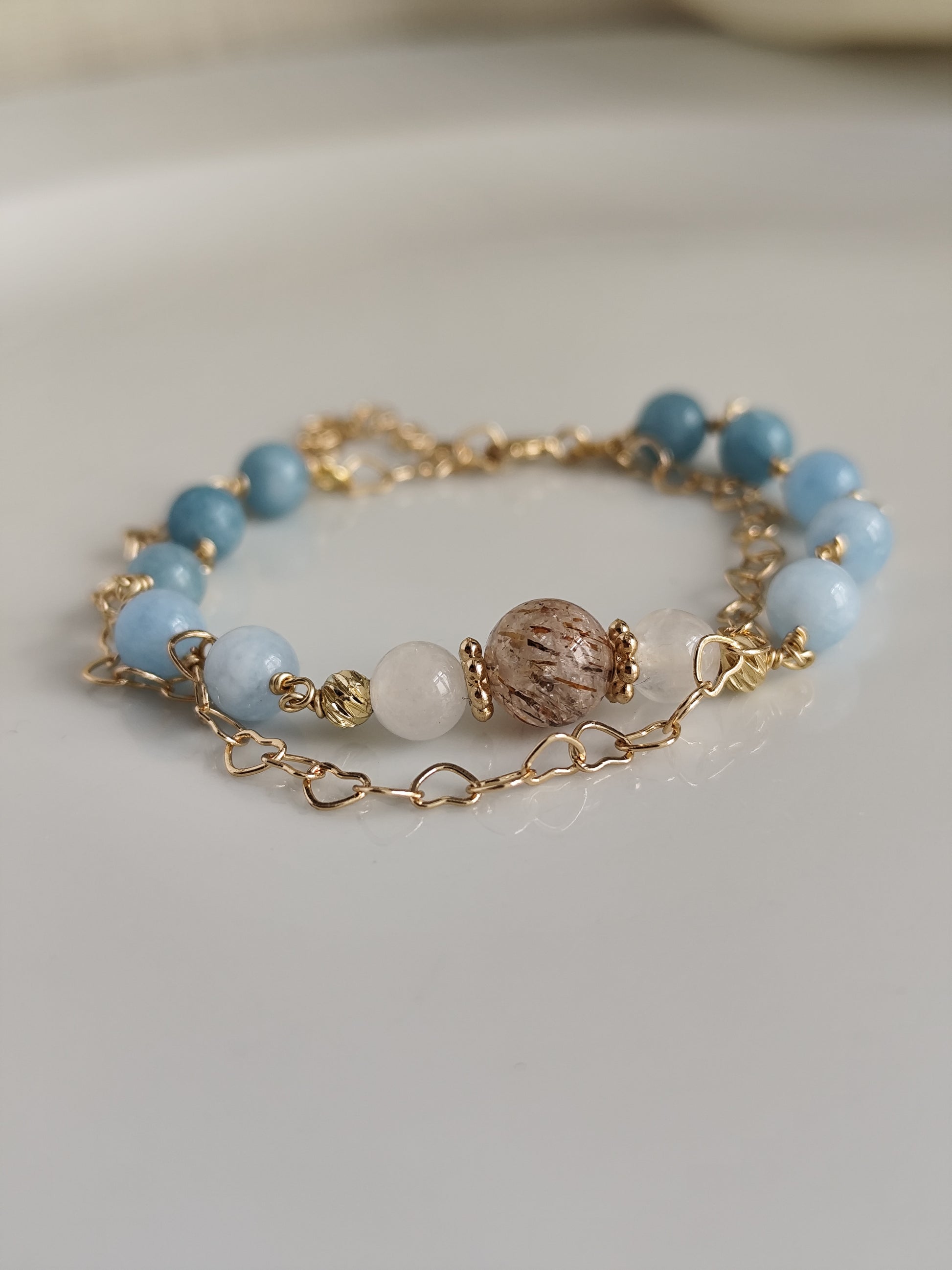 Gemstone bracelet with heart shaped chain