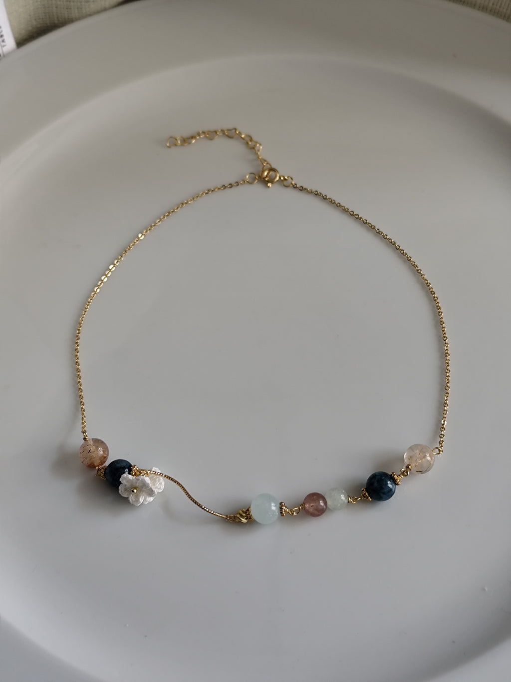 Gemstone design necklace with crocheted flowers