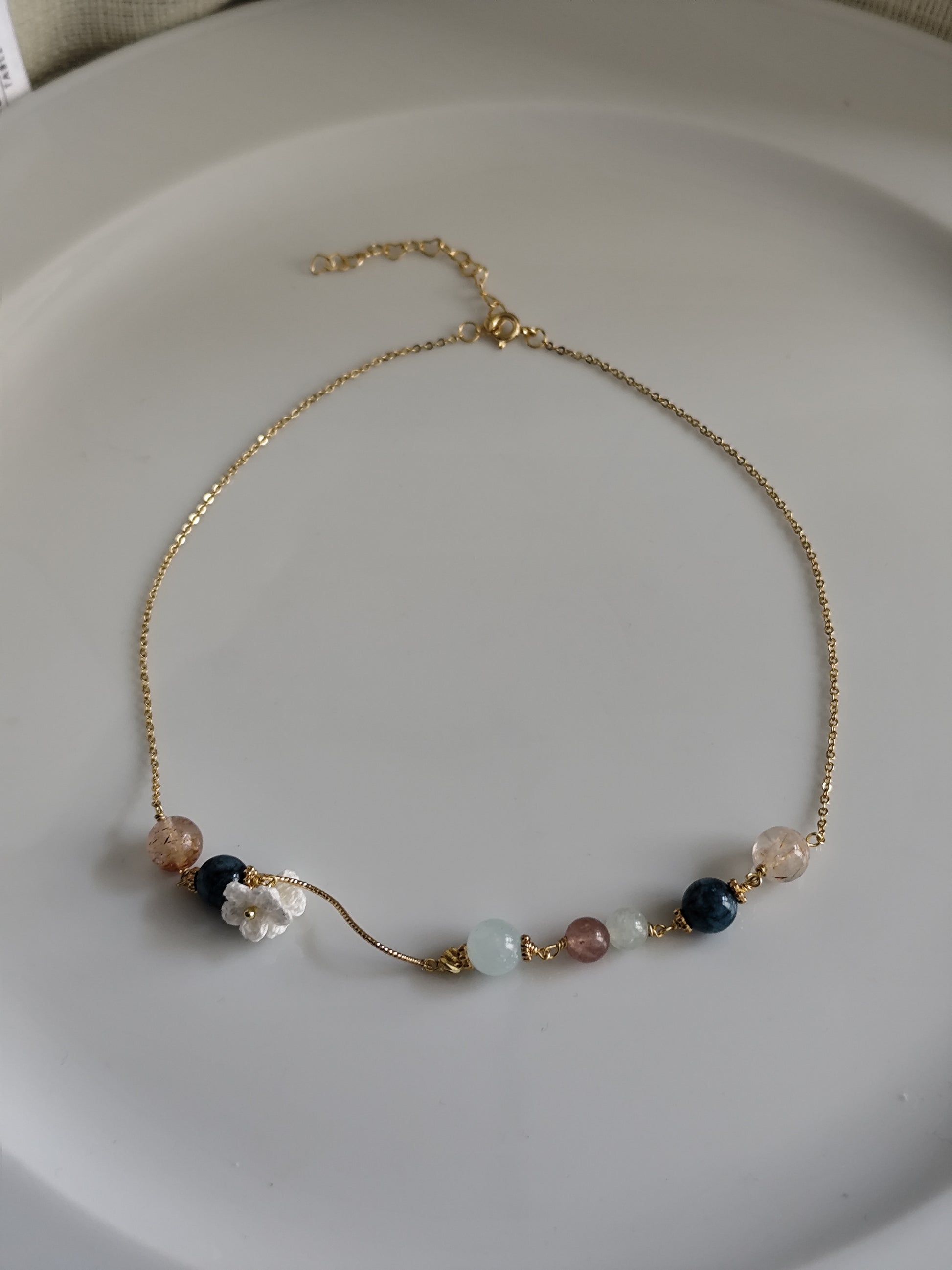 Gemstone design necklace with crocheted flowers