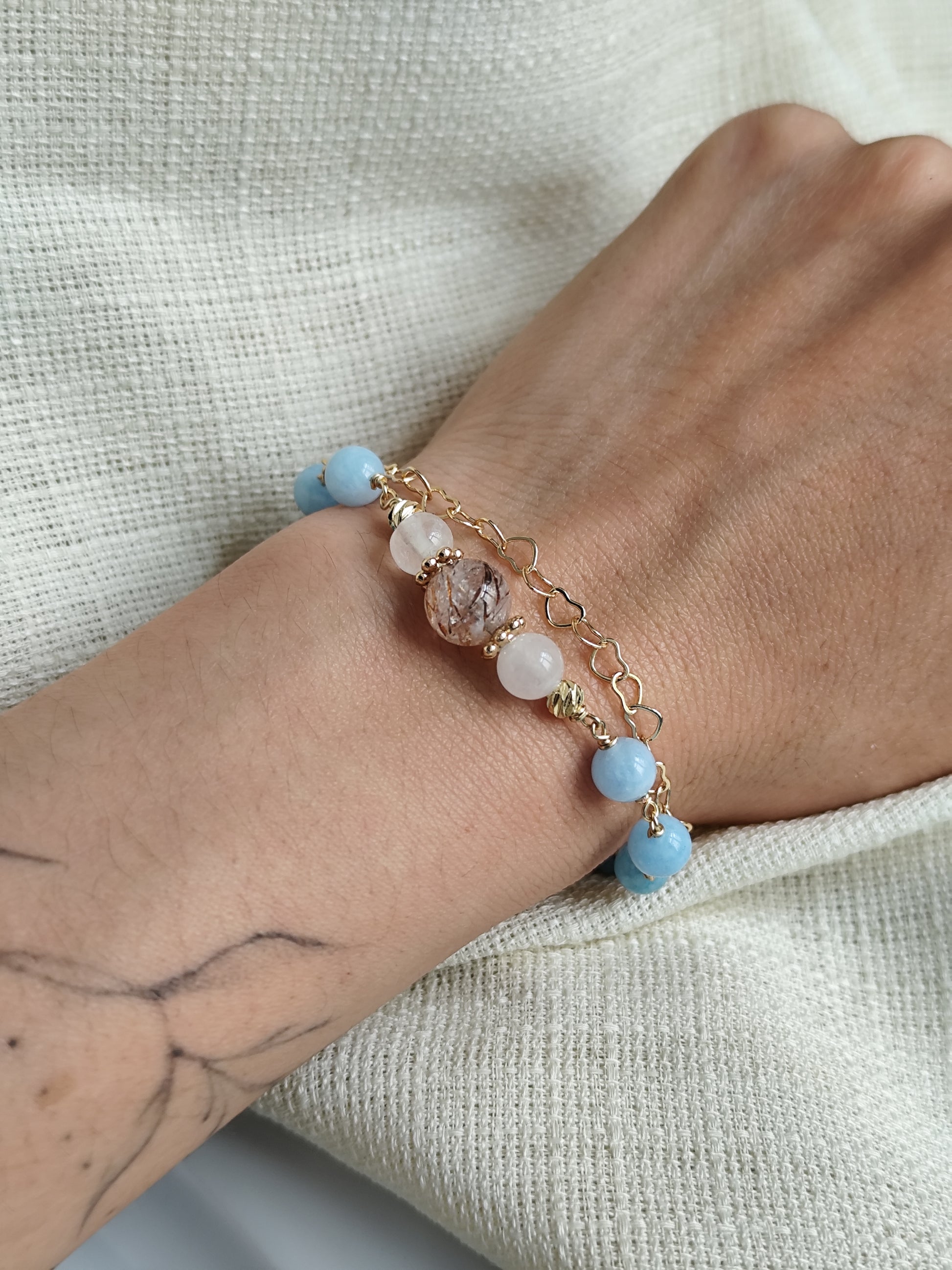 Gemstone bracelet with heart shaped chain