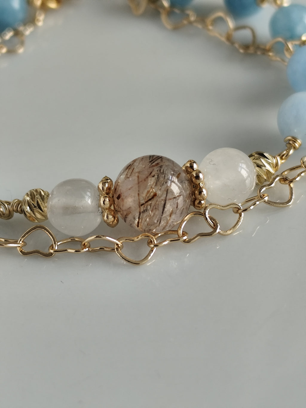 Gemstone bracelet with heart shaped chain