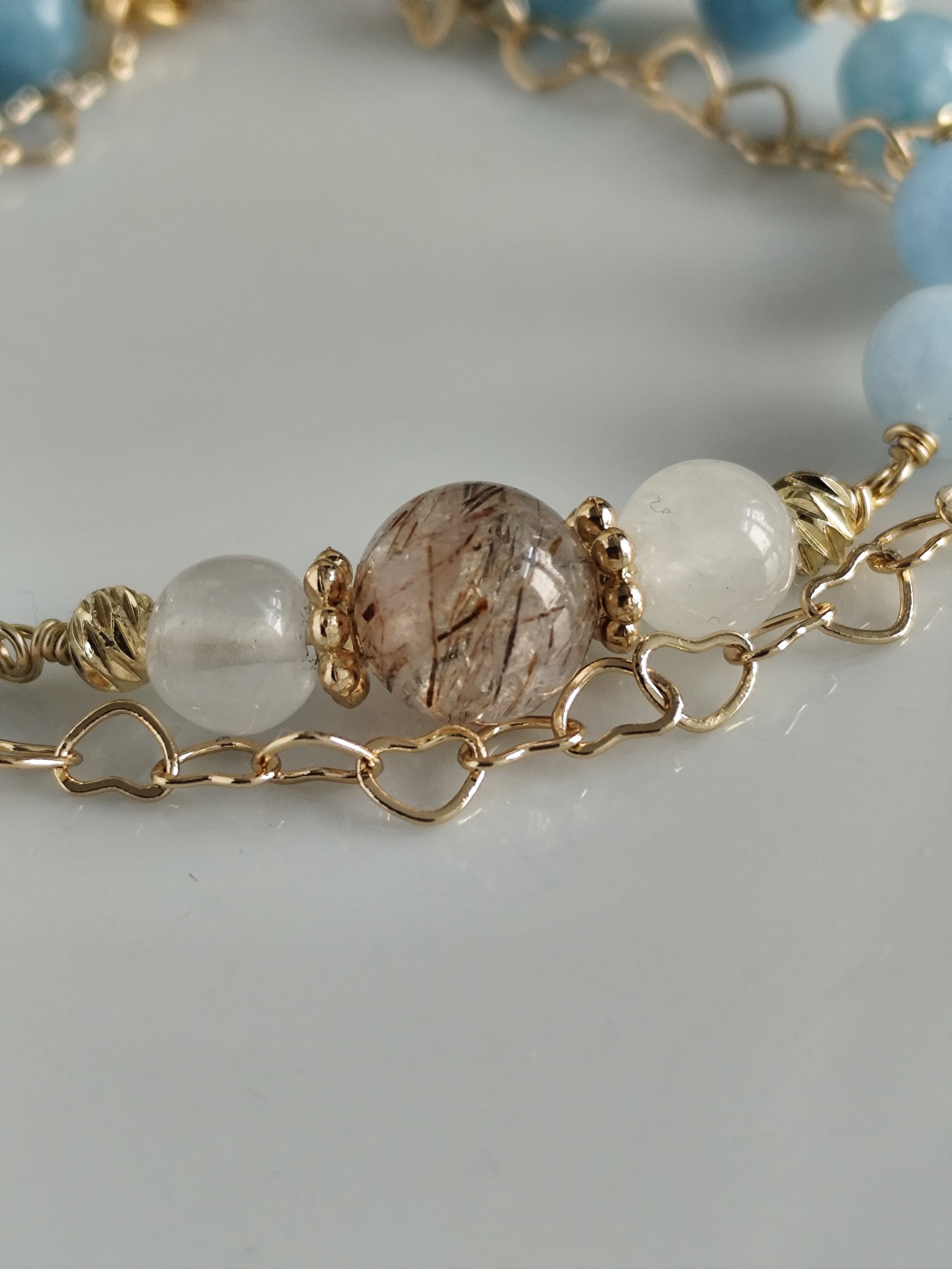 Gemstone bracelet with heart shaped chain