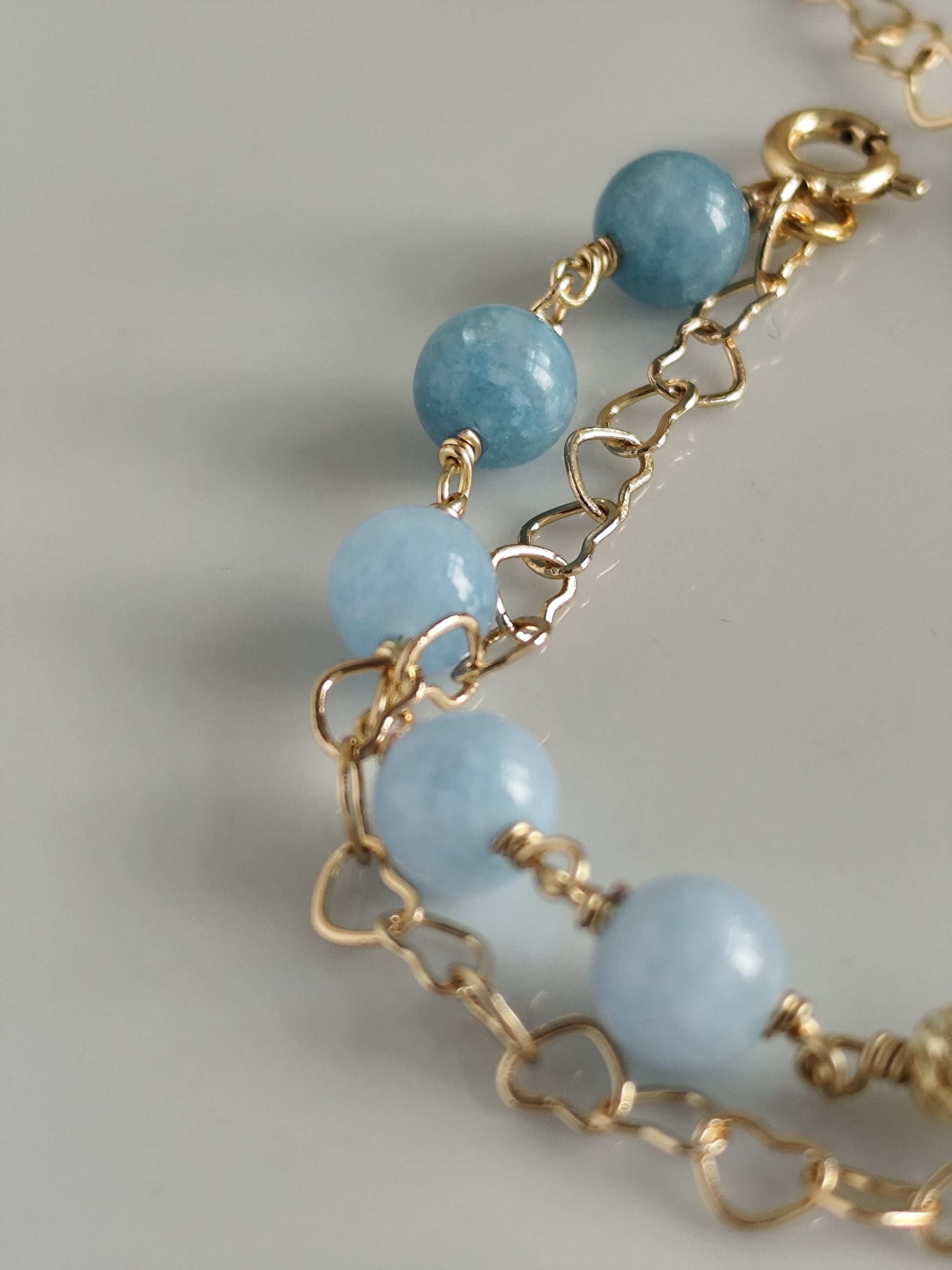 Gemstone bracelet with heart shaped chain