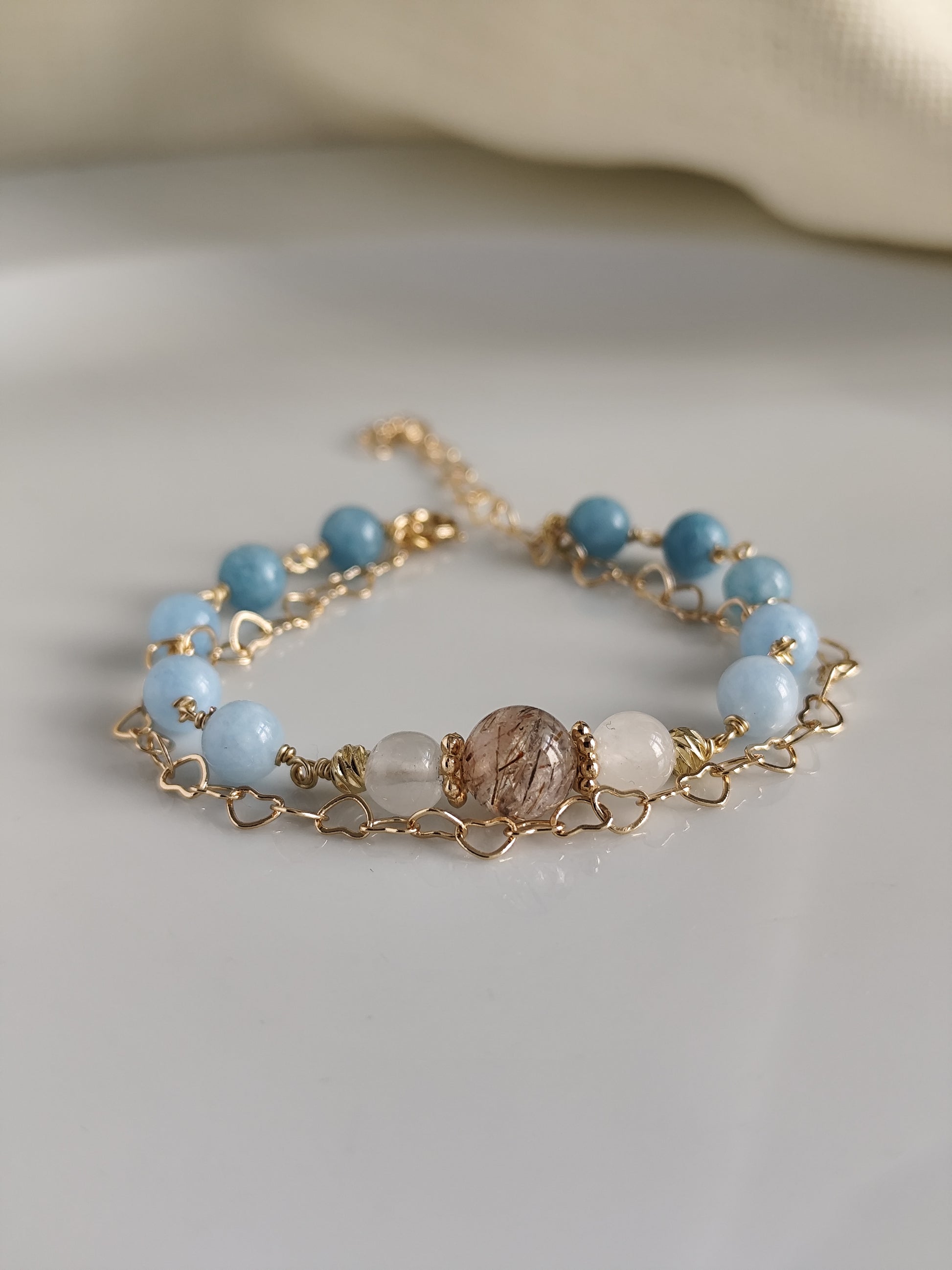 Gemstone bracelet with heart shaped chain